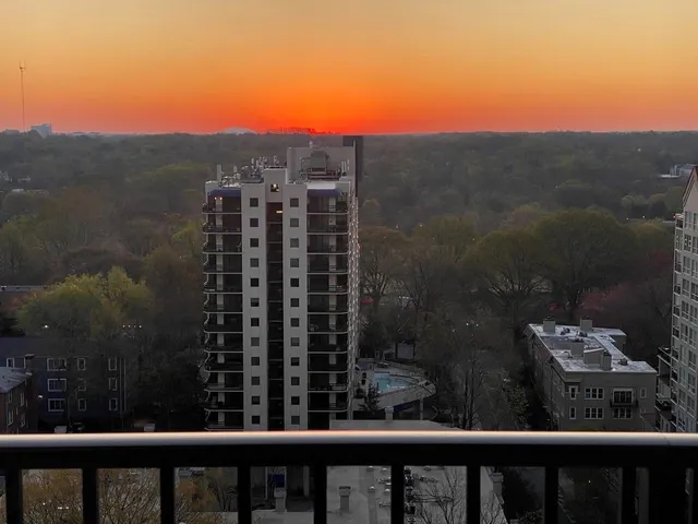 a view of a balcony with a floor to ceiling window