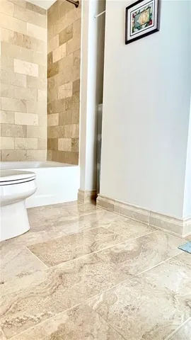a view of a hallway with washer and dryer