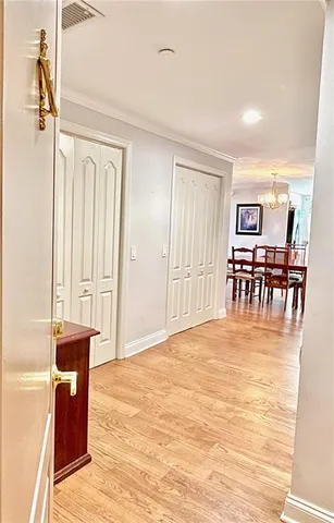 a large room with wooden floor and windows