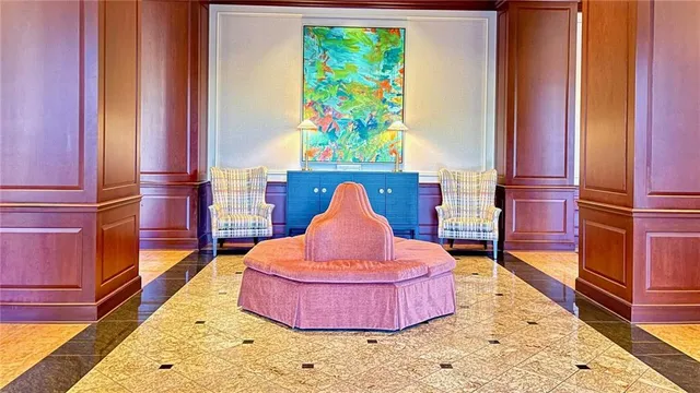 a bedroom with a bed and a dresser in it