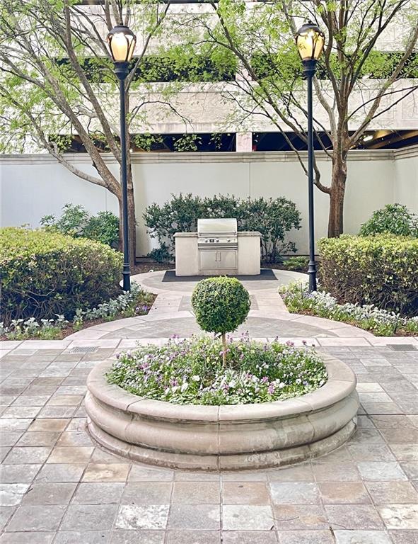 195 14th Street Northeast, Unit 1507 Atlanta, GA 30309 - Photo 53 of 56 a view of a house with fountain in middle