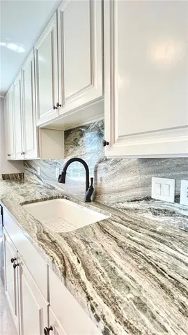 a view of a kitchen with a faucet and roof