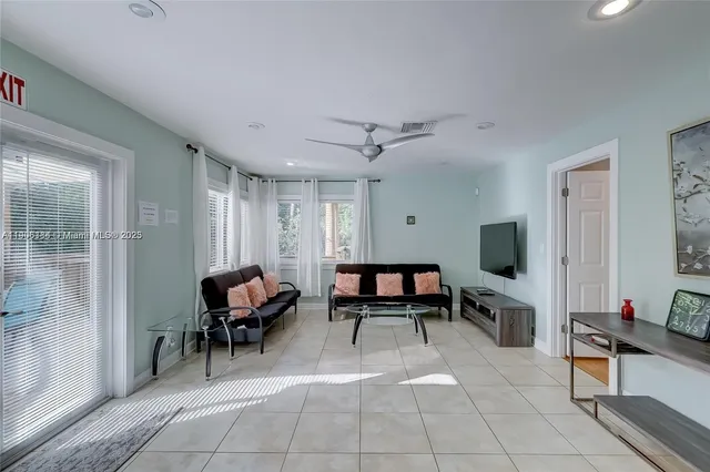 a living room with furniture and a window