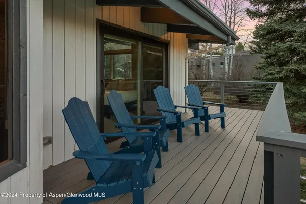 a view of a chairs on the roof deck