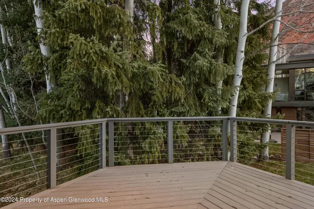 a view of a balcony with wooden floor