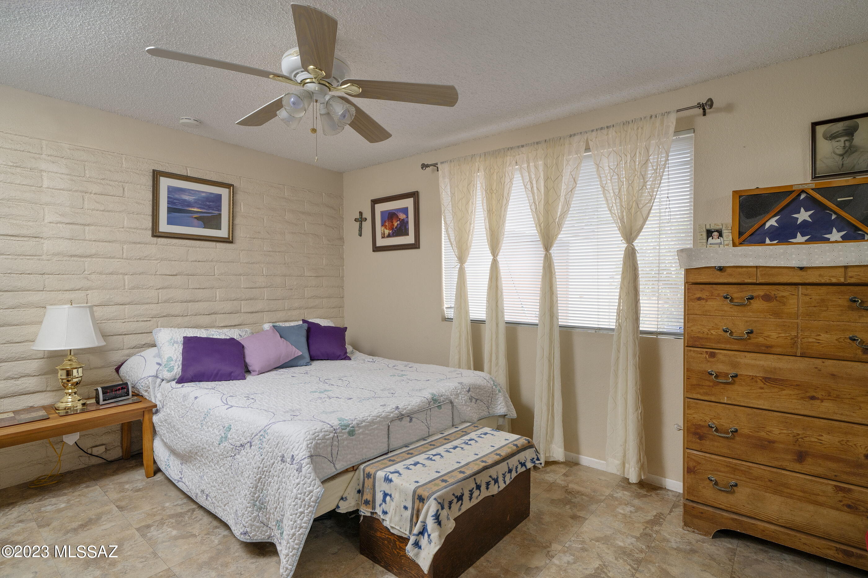 670 South Pantano Road, Unit E Tucson, AZ 85710 - Photo 9 of 17 a bedroom with a bed and a dresser