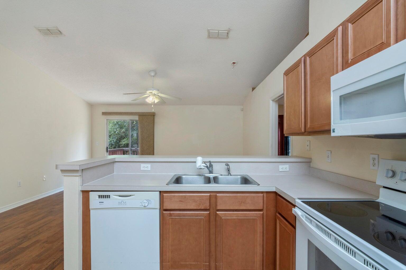 168 Cabana Way Crestview, FL 32536 - Photo 12 of 29 a kitchen with granite countertop a sink and cabinets