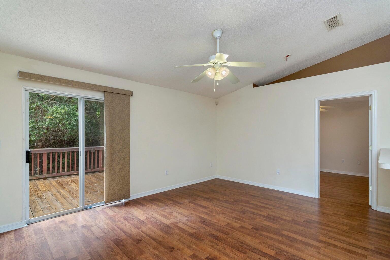 168 Cabana Way Crestview, FL 32536 - Photo 13 of 29 a view of empty room with wooden floor and fan