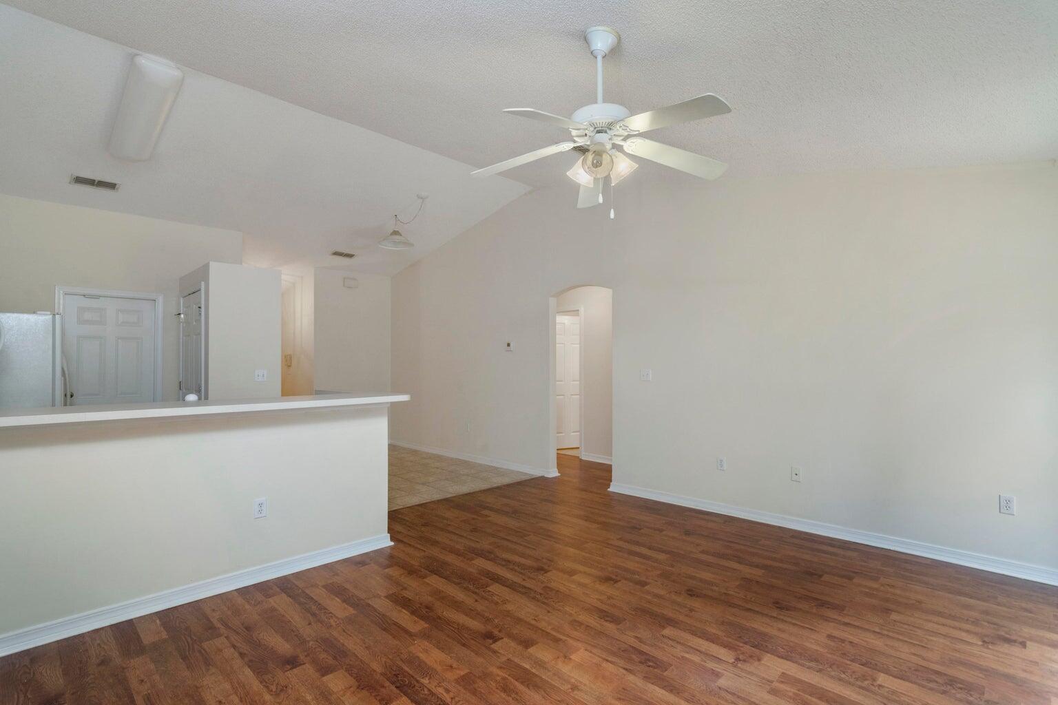 168 Cabana Way Crestview, FL 32536 - Photo 14 of 29 a view of an empty room with wooden floor