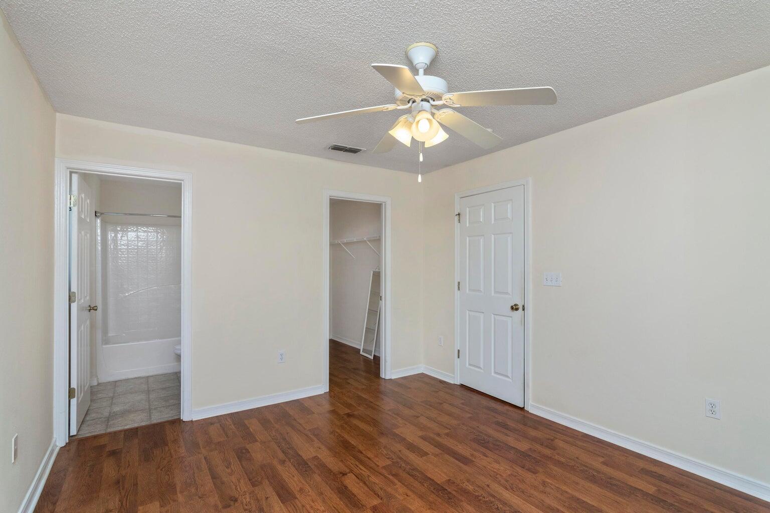 168 Cabana Way Crestview, FL 32536 - Photo 16 of 29 a view of an empty room and wooden floor