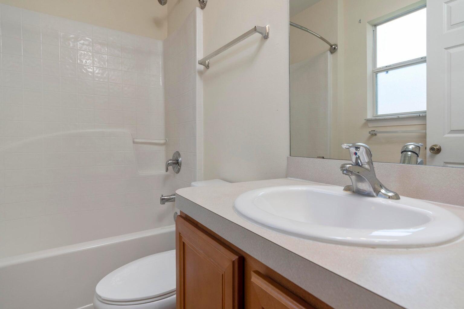 168 Cabana Way Crestview, FL 32536 - Photo 17 of 29 a bathroom with a sink toilet and shower