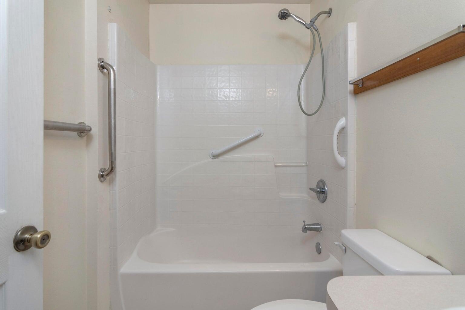 168 Cabana Way Crestview, FL 32536 - Photo 18 of 29 a bathroom with a bath tub with a shower