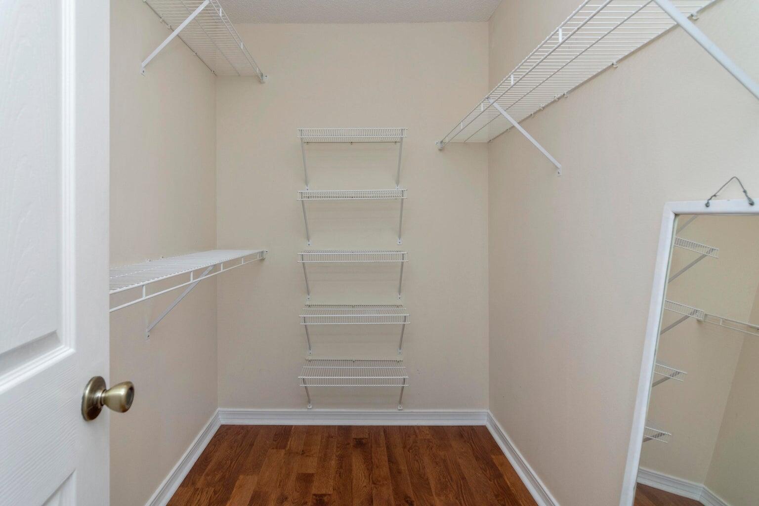 168 Cabana Way Crestview, FL 32536 - Photo 20 of 29 a view of walk in closet with empty racks