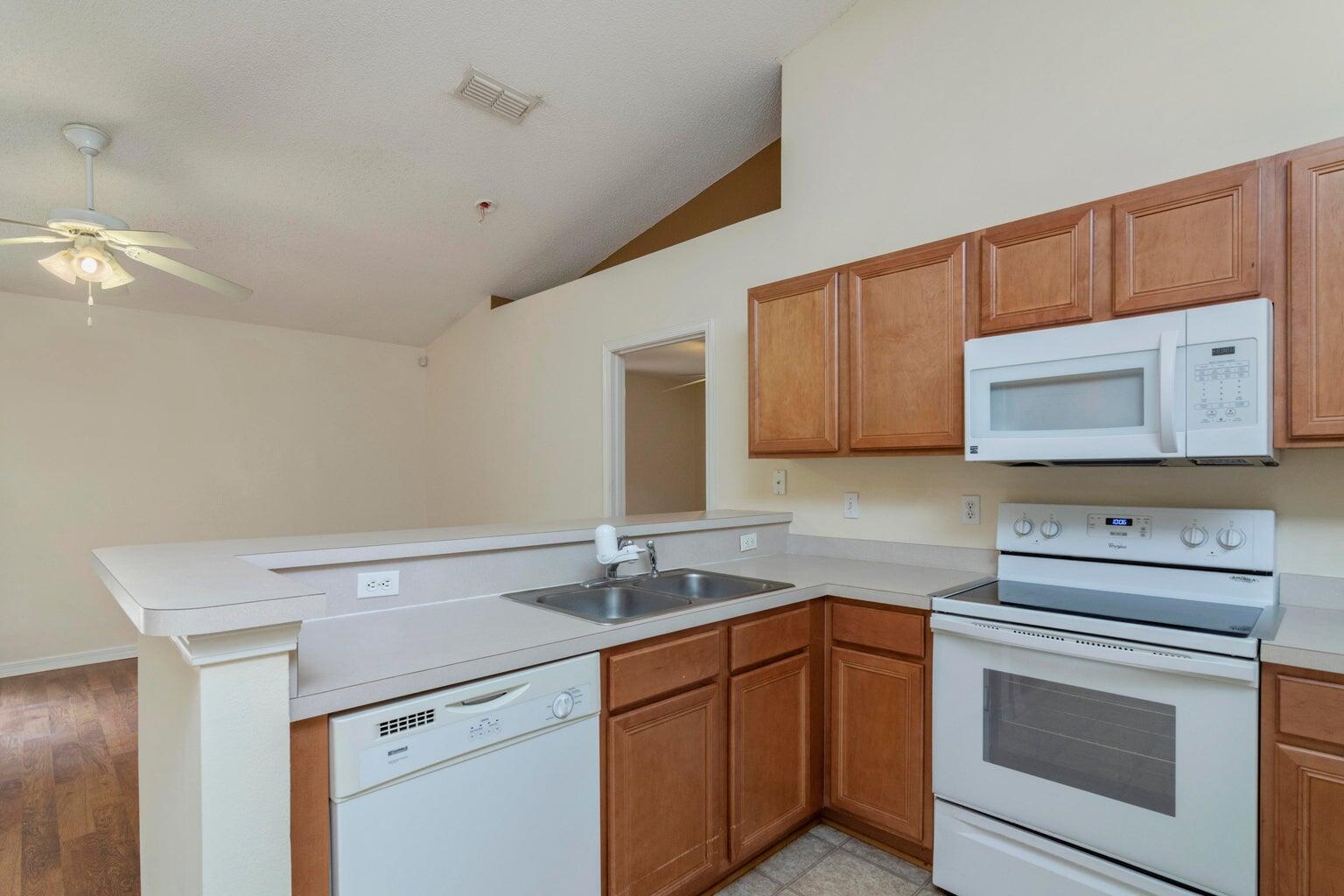 168 Cabana Way Crestview, FL 32536 - Photo 10 of 29 a kitchen with a sink cabinets and microwave