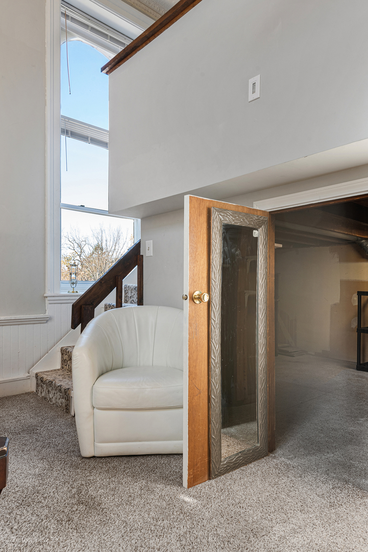 400 McCarthy Road, Unit 207 Lemont, IL 60439 - Photo 8 of 19 a living room with furniture and a window