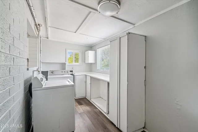 a kitchen with a sink cabinets and window