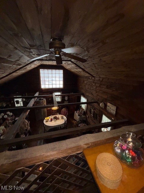 15639 Grove Road Southwest Port Washington, OH 43837 - Photo 19 of 31 Wine room featuring wood ceiling, lofted ceiling, a ceiling fan, and wood walls