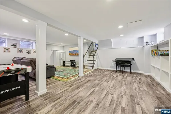 a view of a kitchen with dining room and wooden floor