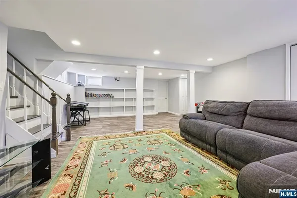 a living room with furniture and a rug