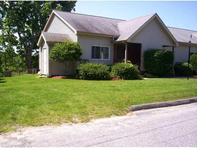 5 Frontage Point, Unit E Danielson, CT 06239 - Photo 1 of 1 a front view of house with yard and green space