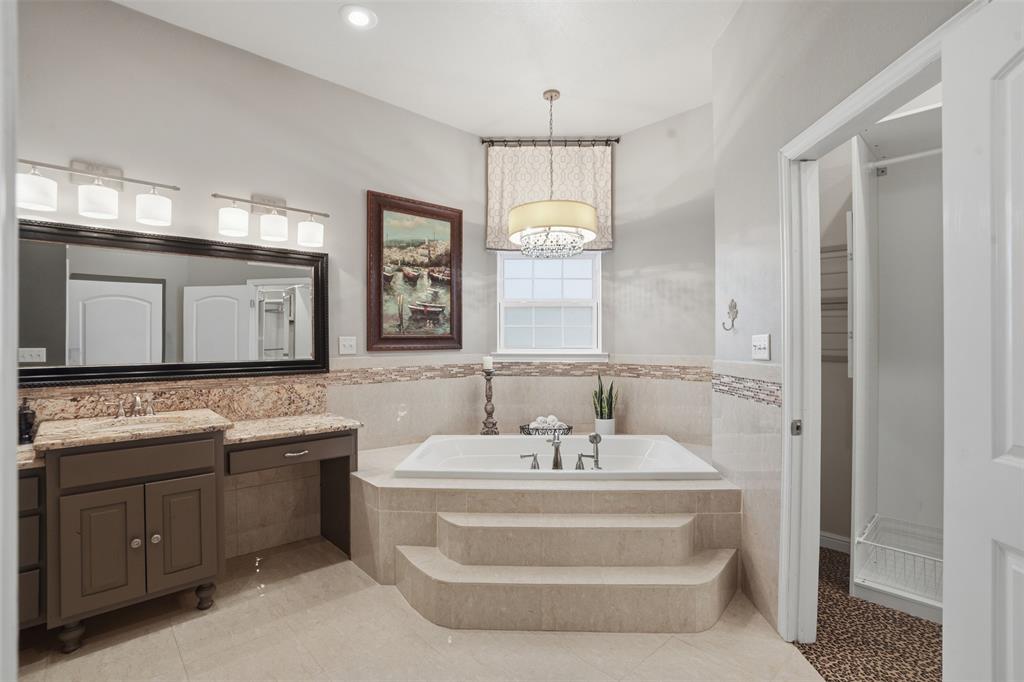 9651 Yellow Rose Lane Pilot Point, TX 76258 - Photo 21 of 38 a bathroom with a double vanity sink mirror and bathtub