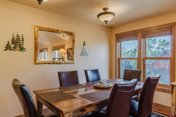 a view of a dining room with furniture window and outside view