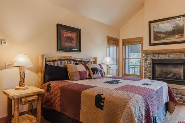 a bed room with a bed and a fireplace