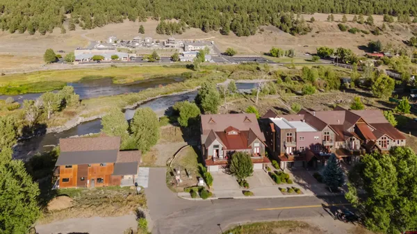 an aerial view of residential houses with outdoor space