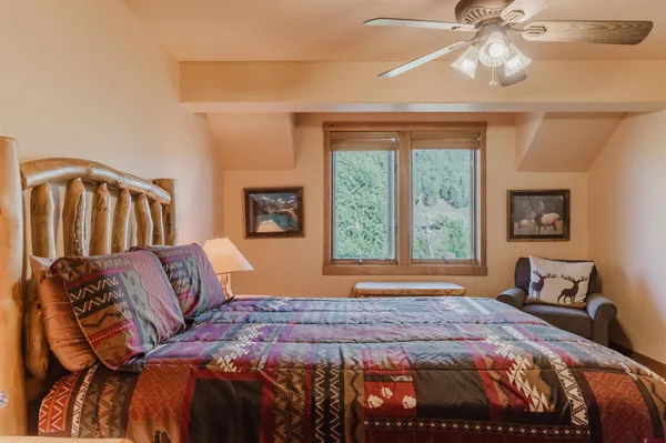 a bedroom with a bed and window