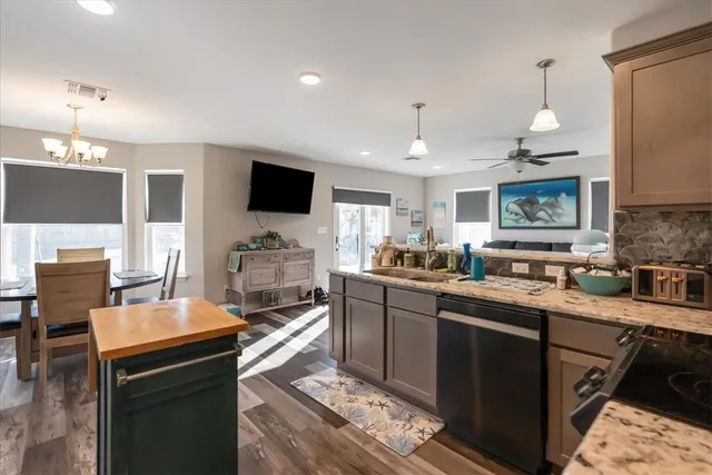 a kitchen with a sink stove and microwave