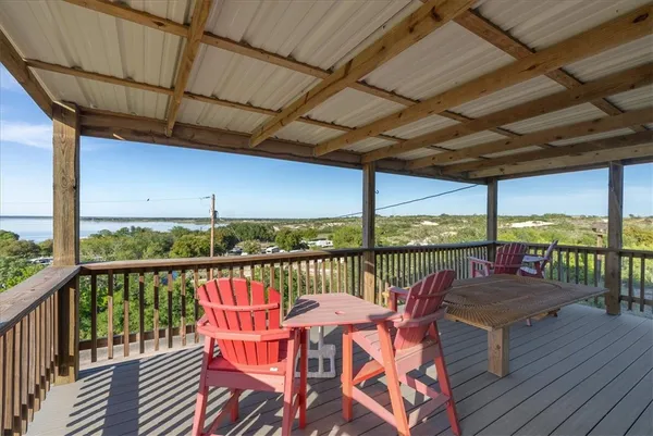 a view of a balcony with chairs