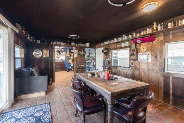 a outdoor dining space with furniture and window