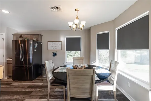 a view of a dining room with furniture window and outside view