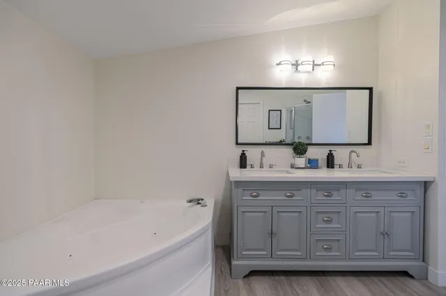 a bath room with a sink and a mirror