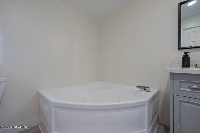 a white bath tub sitting in a bathroom