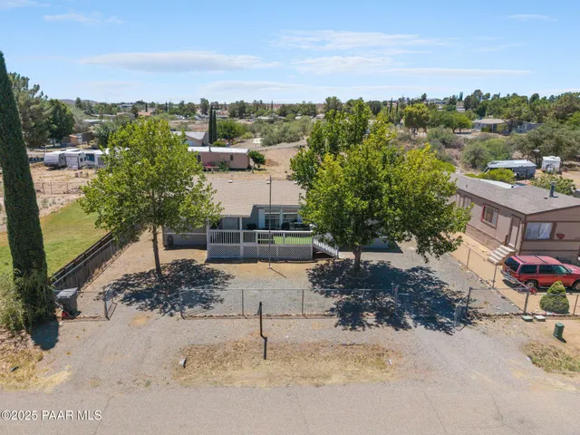 a view of a terrace with couches and sky view
