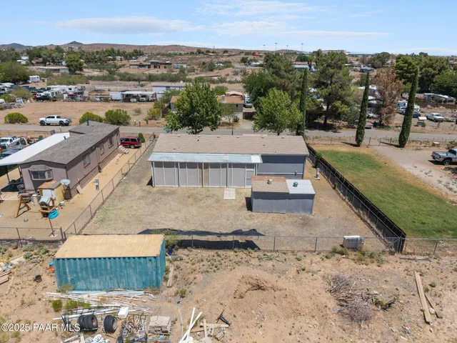 a backyard of a house with a tree