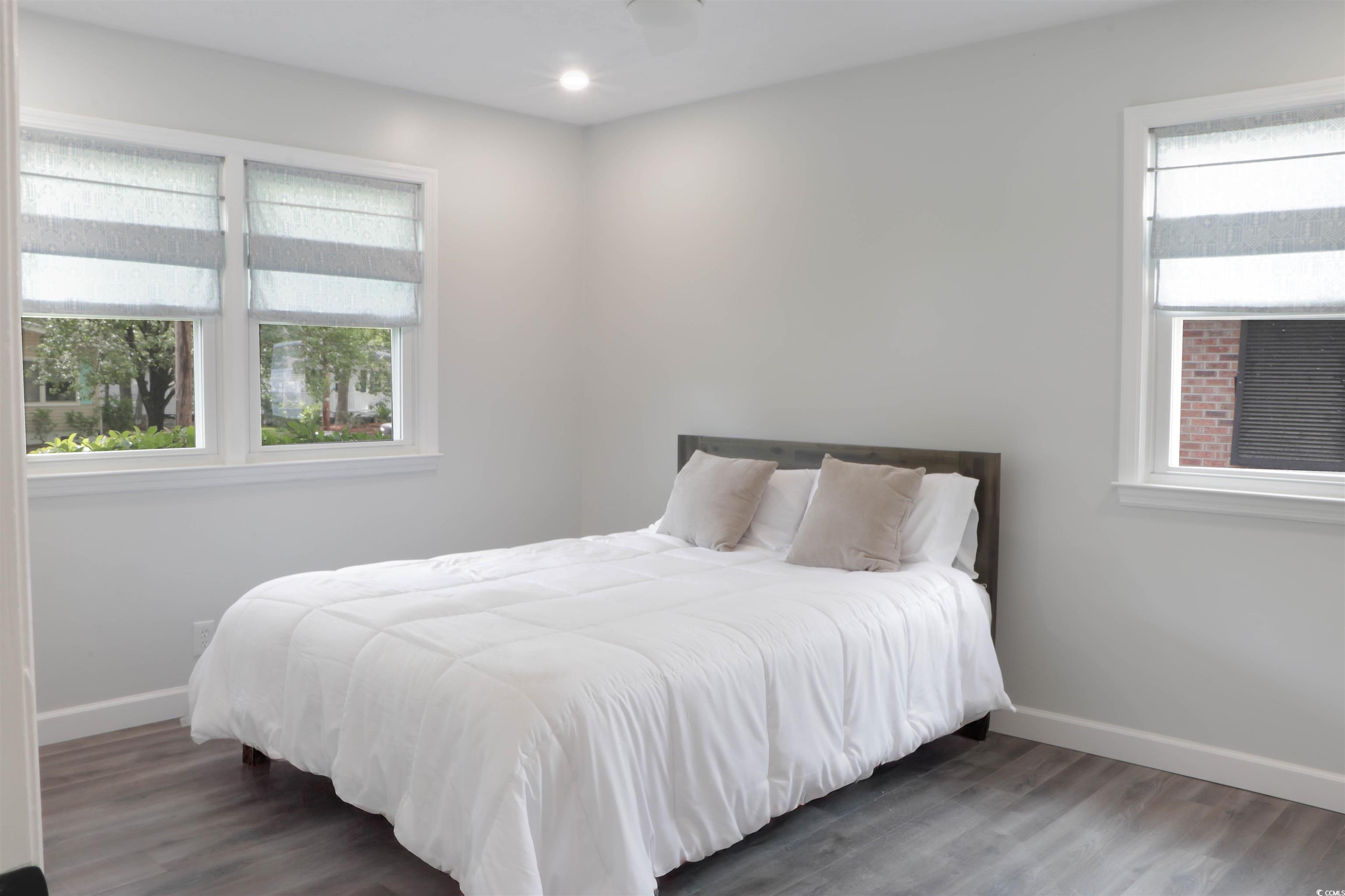 1014 Bay Drive Surfside Beach, SC 29575 - Photo 15 of 27 Bedroom featuring baseboards, wood finished floors, and recessed lighting