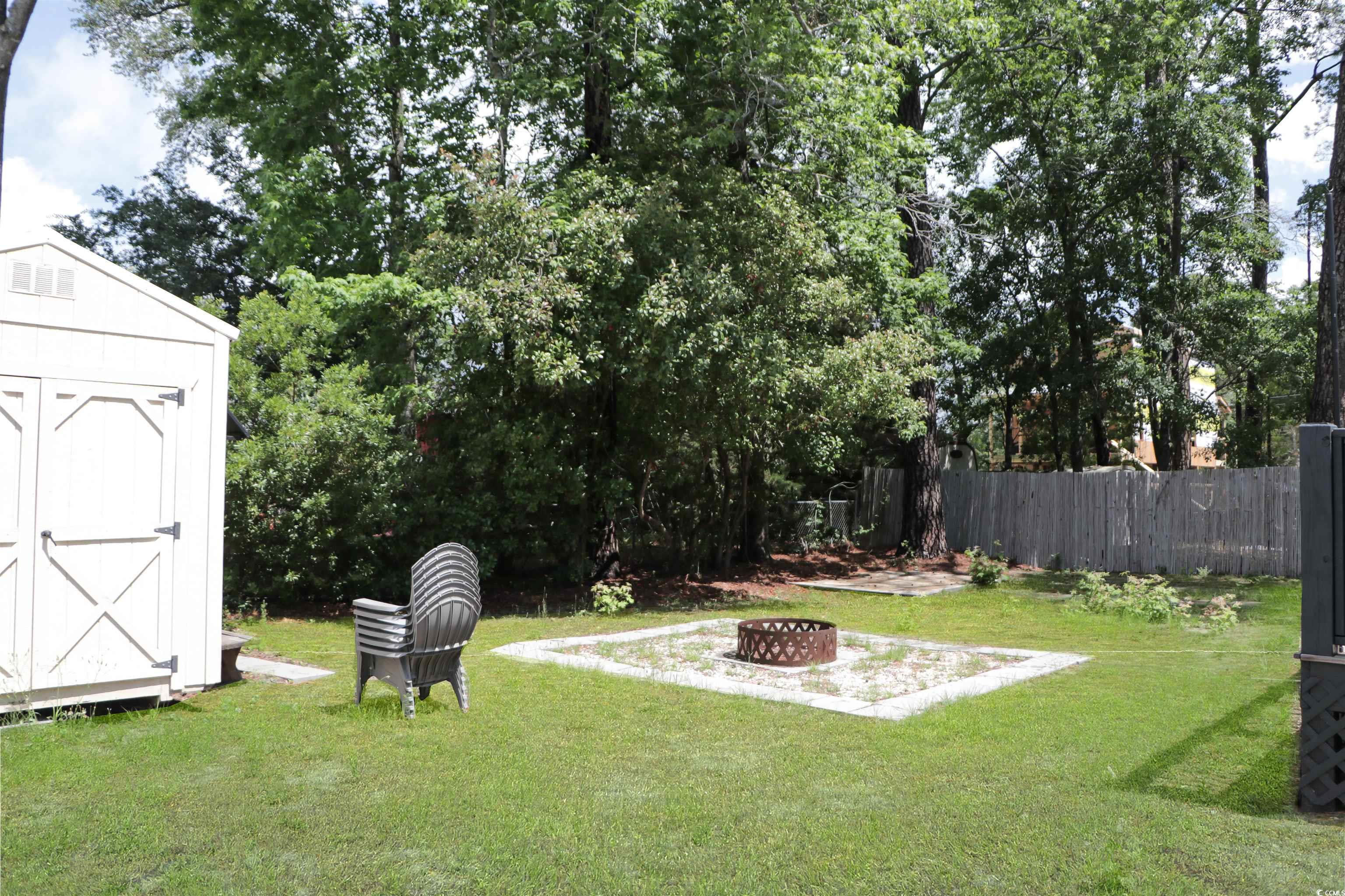 1014 Bay Drive Surfside Beach, SC 29575 - Photo 27 of 27 View of yard with a fire pit