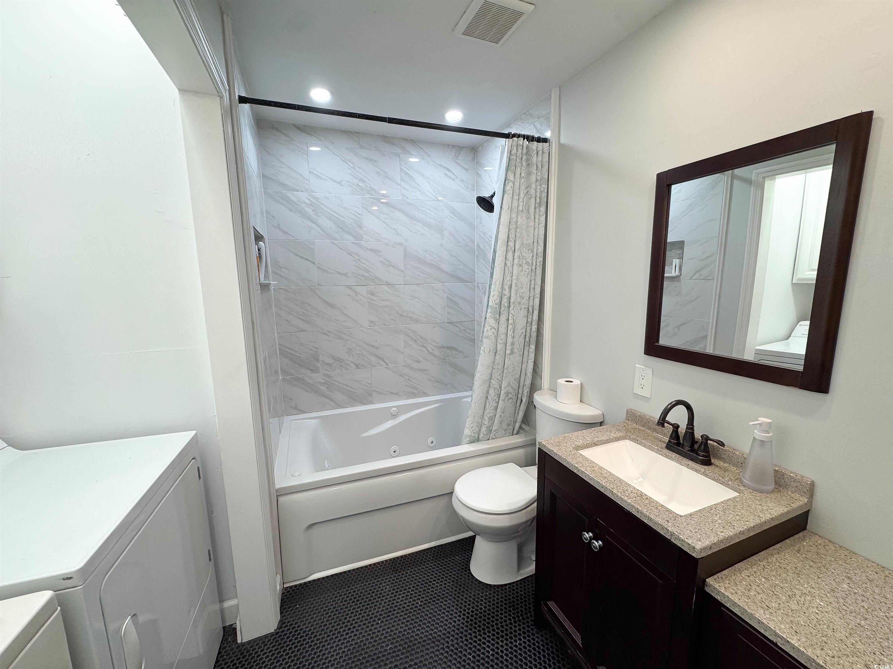 1014 Bay Drive Surfside Beach, SC 29575 - Photo 6 of 27 Full bath with separate washer and dryer, toilet, shower / tub combo, vanity, and recessed lighting