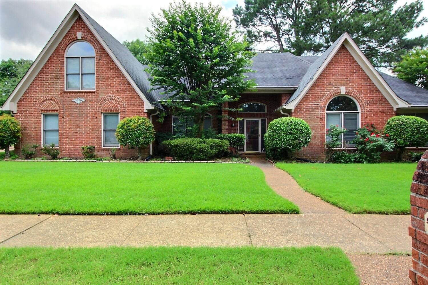 a view of outdoor space yard and front view of a house