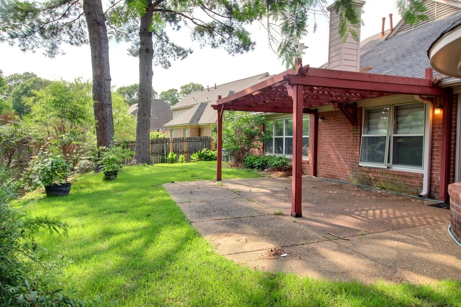 275 Home Place Collierville, TN 38017 - Photo 21 of 23 a view of a house with backyard and a tree