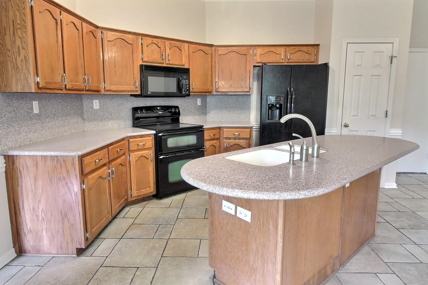 275 Home Place Collierville, TN 38017 - Photo 8 of 23 a kitchen with a sink a stove and cabinets