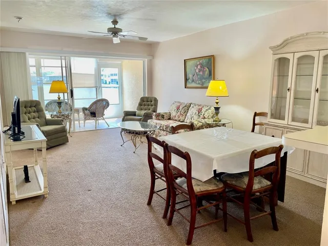 a view of a dining room with furniture and a livingroom