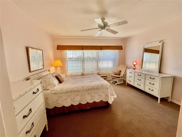 a bed room with a bed and a window