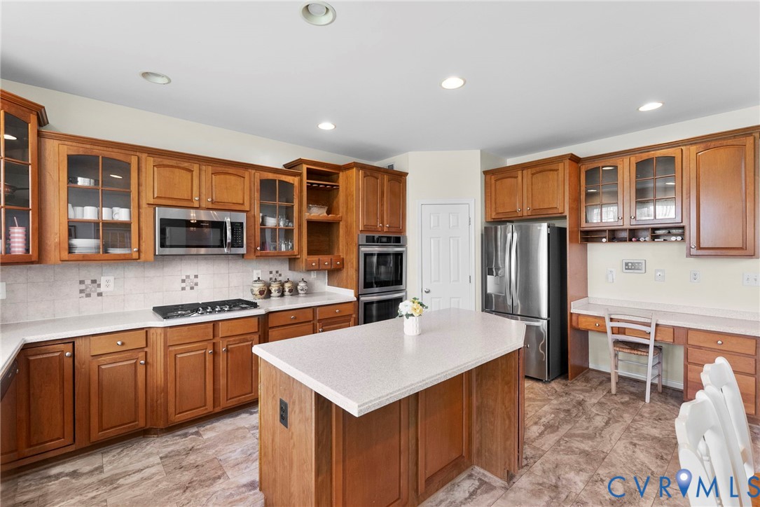 753 Blossom Tree Road Culpeper, VA 22701 - Photo 32 of 68 Kitchen featuring wood cabinetry, a central island