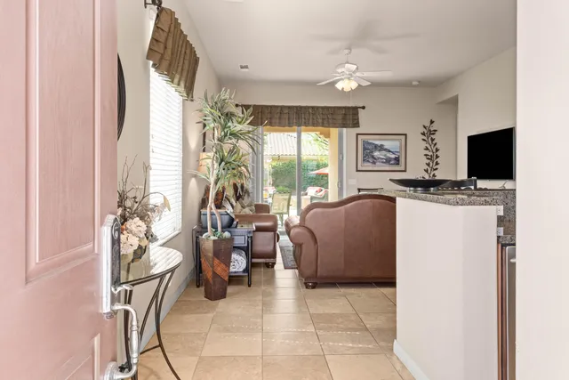 a living room with fireplace furniture and a flat screen tv