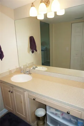 a bathroom with a sink and a mirror