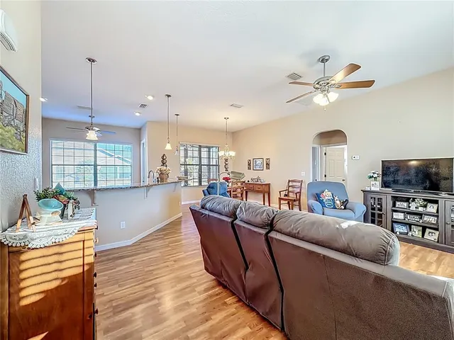 a living room with furniture fireplace and a flat screen tv