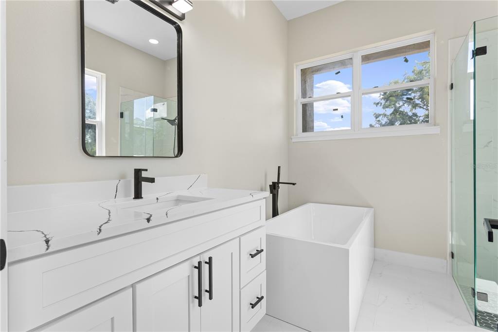 33328 County Road 473 Leesburg, FL 34788 - Photo 12 of 28 a bathroom with 2 sink and a mirror